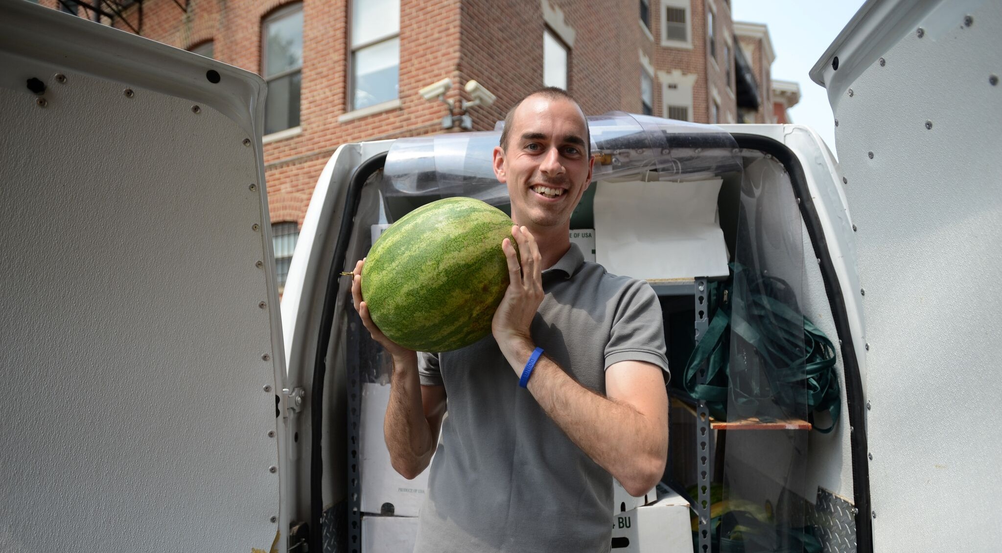 Tom from 4P Foods carrying food donations